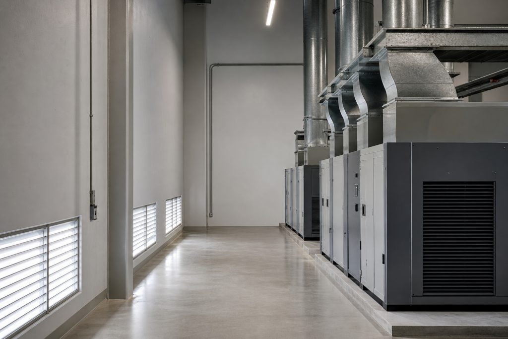 compressor room ventilation layout with low-level fresh air and high-level heat collection
